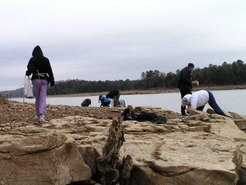 hunting fossils by lake