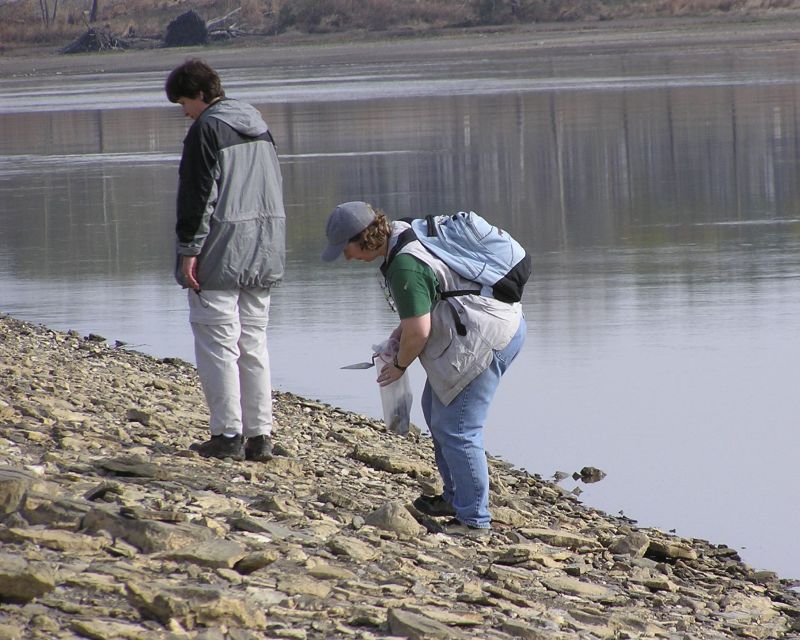 Lea and Claire collecting fossils at lake