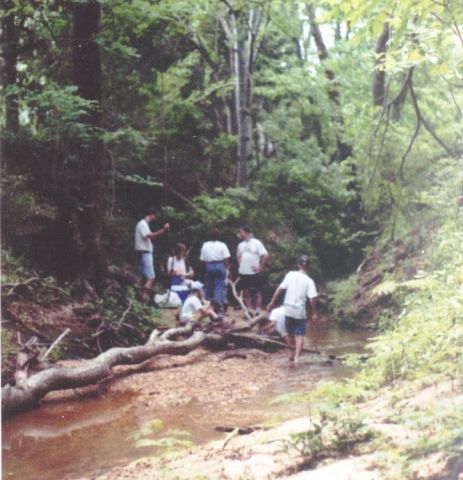 group of people on creek