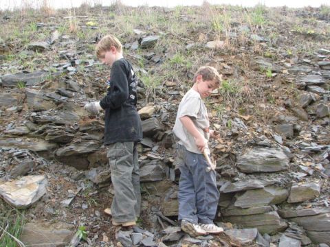 Noah and Matthew search for fossils.