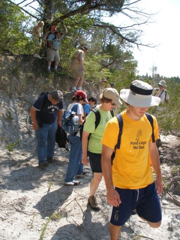 people climbing into gully