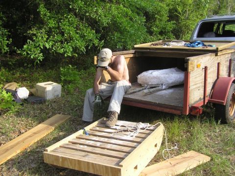 James Lamb is exhausted, after hauling the heavy Eotrachodon orientalis dinosaur skull jacket up a steep hill.  It's now safe, and ready for transport to McWane Science Center.