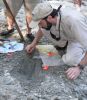 James Lamb examining bone from <em>Eotrachodon orientalis</em> dinosaur
