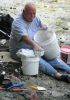 Greg mixing plaster and making the protective jacket for the leg bone of Eotrachodon orientalis dinosaur